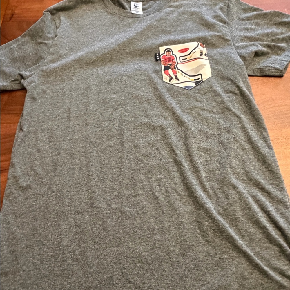 Gray Graphic Pocket  Hockey Theme T-Shirt - Size medium